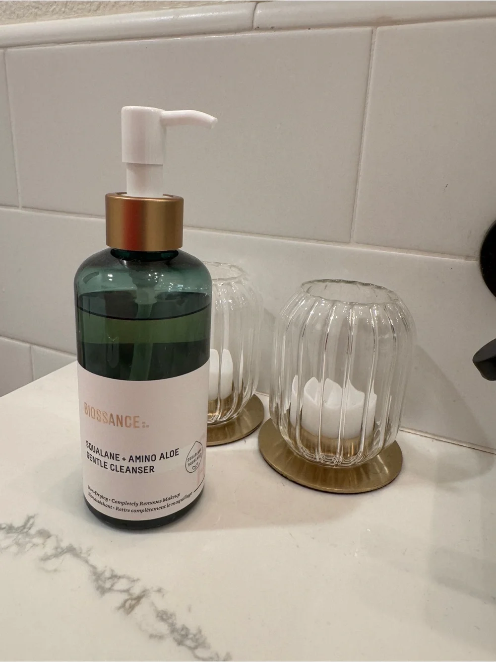 Biossance green and gold pump facial cleanser